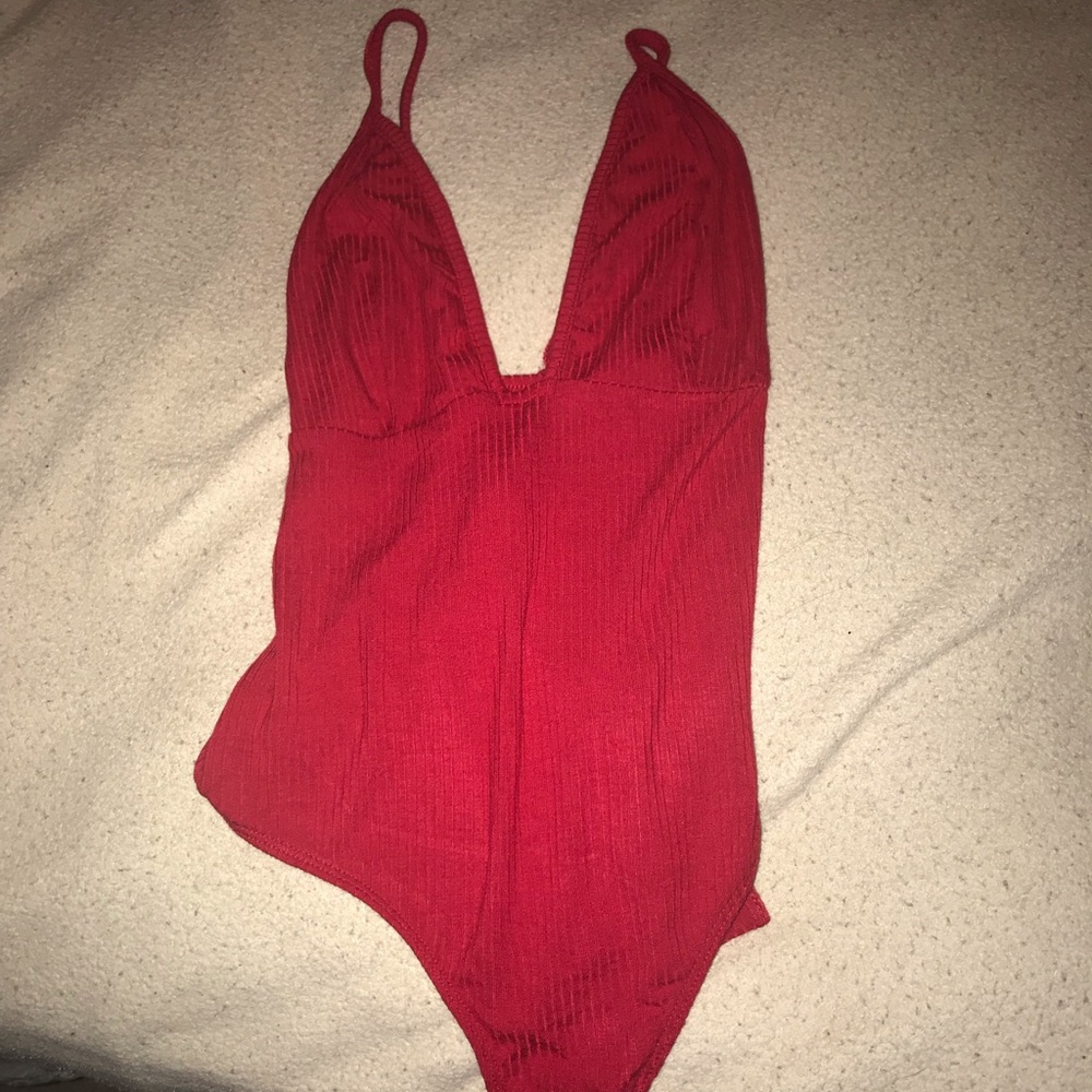 A red body suit
